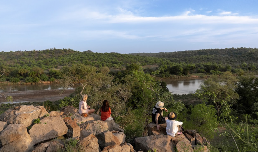 Looking out over the river and wooded hills from a rocky viewpoint